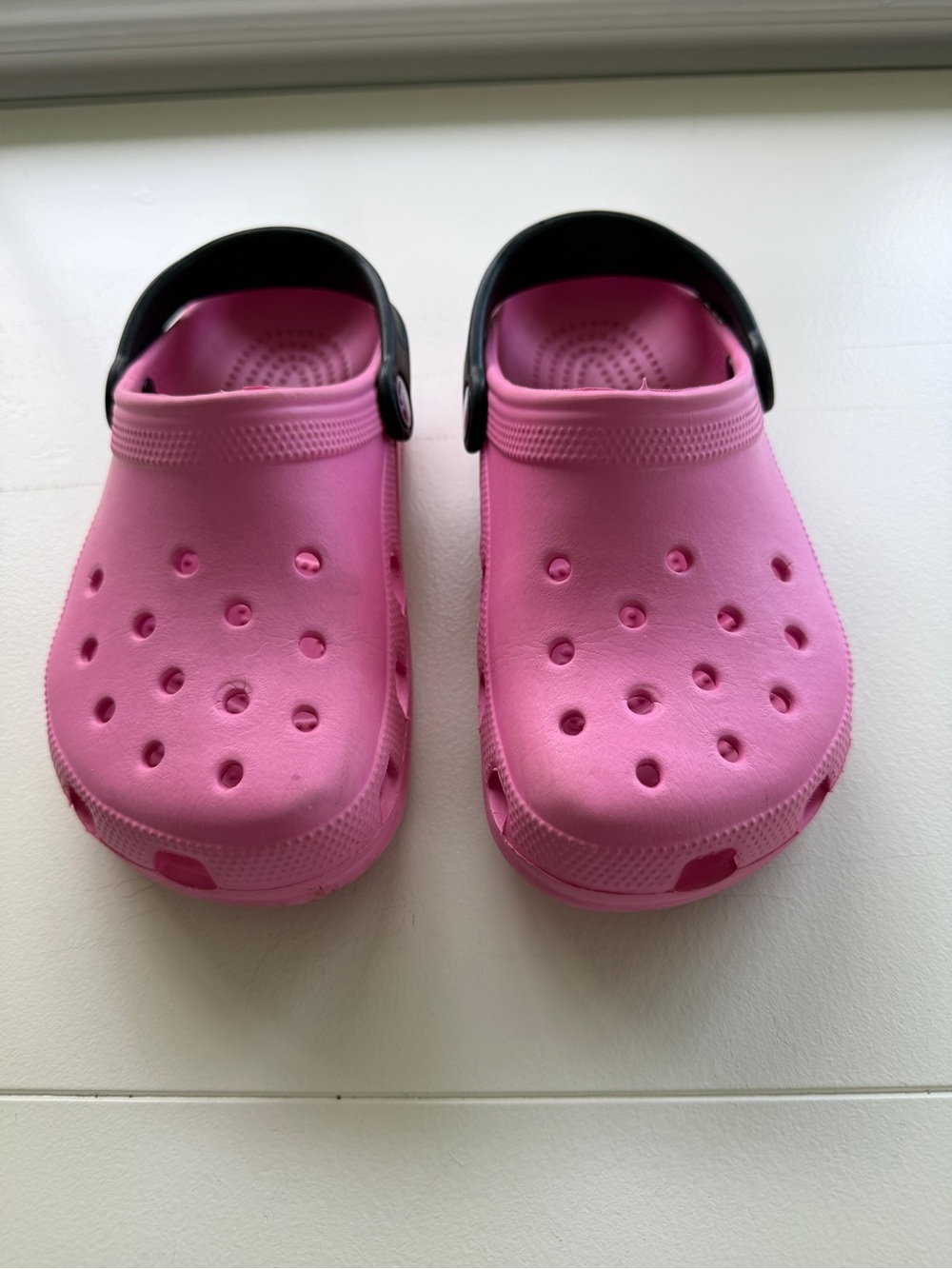 CROCS Kids Pink Clogs with Black Heel Strap